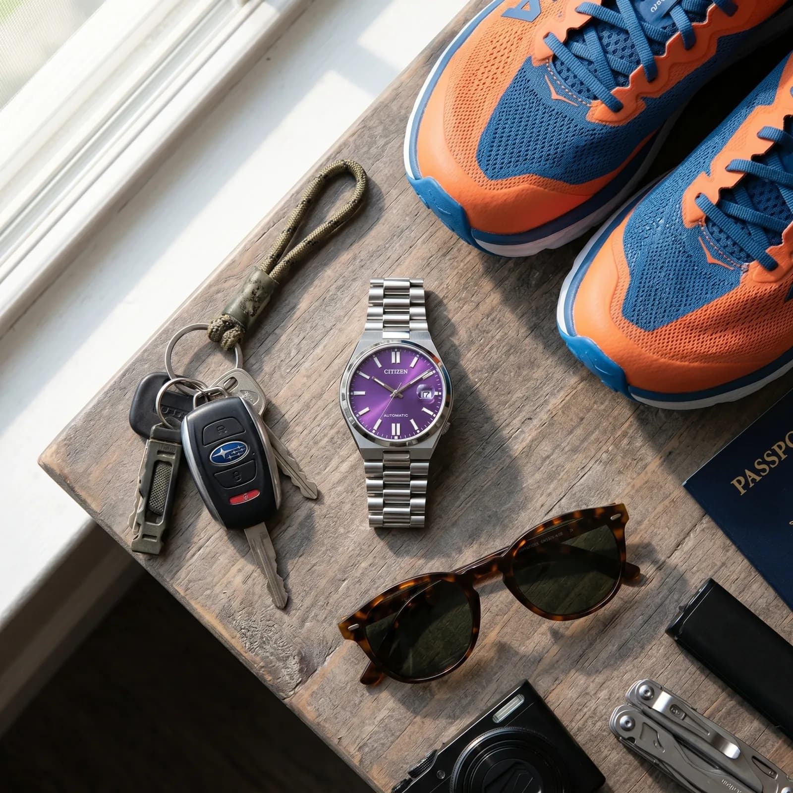 Citizen Tsuyosa NJ0200-50W on a table in soft light showing its purple dial and integrated bracelet