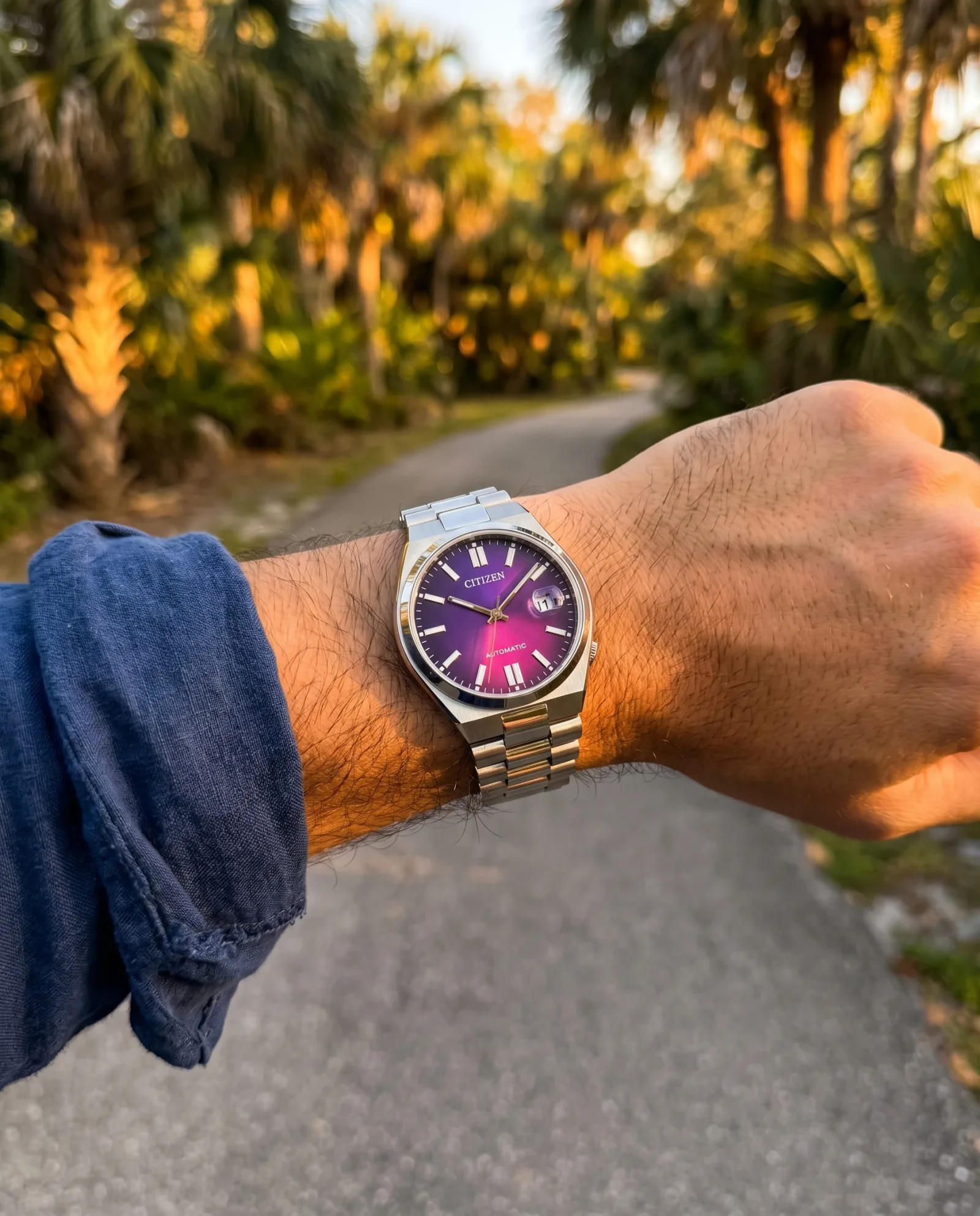 Citizen Tsuyosa NJ0200-50W worn outdoors, showing how the 37 mm case and integrated bracelet sit on the wrist